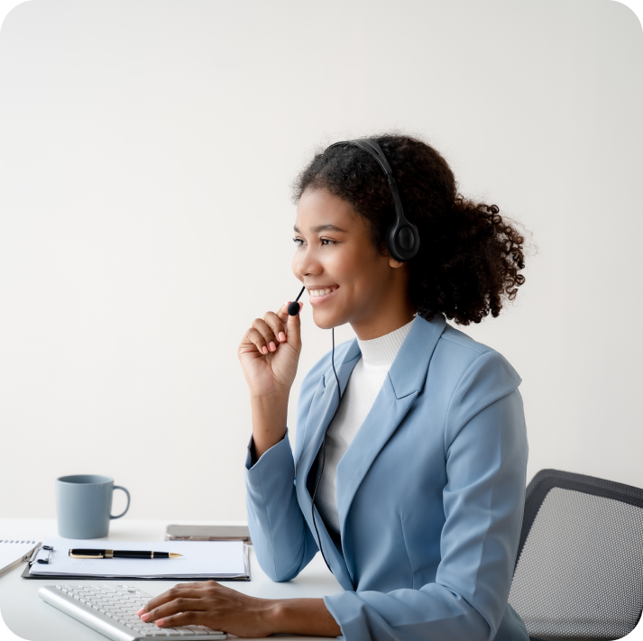 Customer support agent talking to a customer via headset.