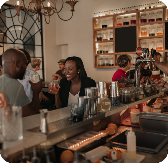 people enjoying drinks at a bar